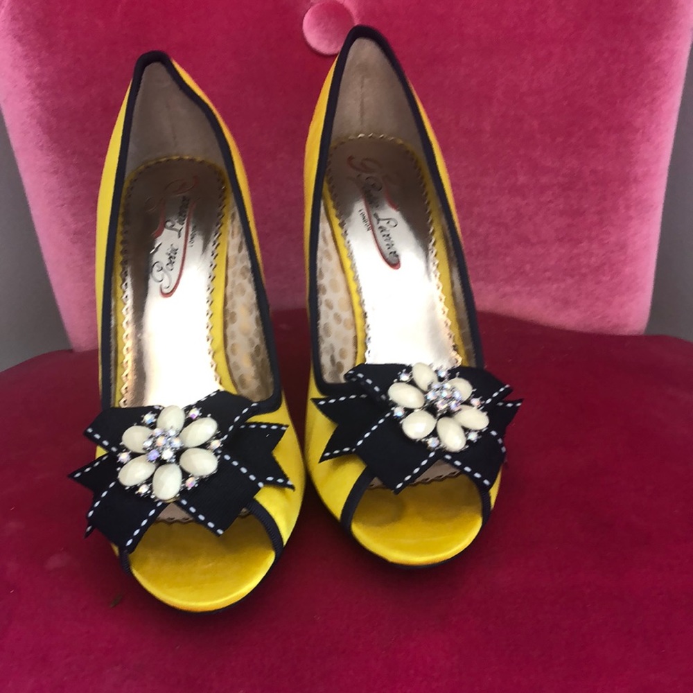 Yellow satin peep toe heels with embellishments